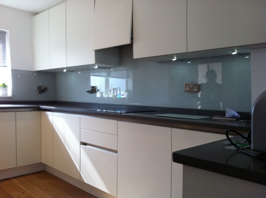 Grey glass kitchen splashback with LED lighting in Surbiton